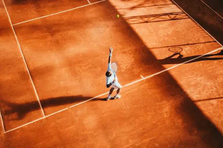 man playing tennis. How do professional tennis players earn money?