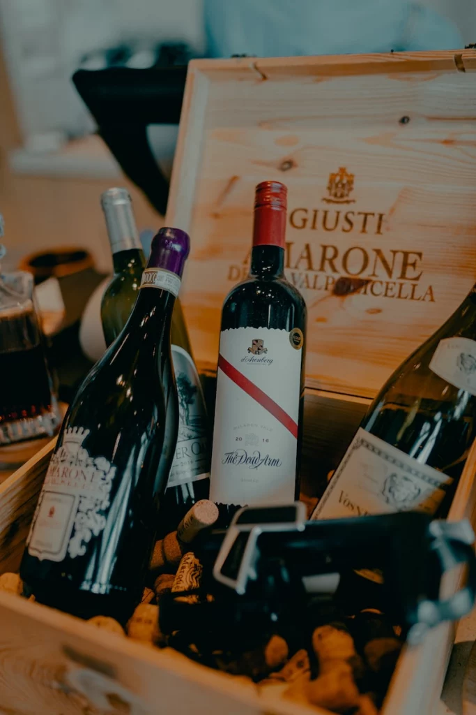 Wine importing: prices, profits, revenues and costs. Understand the wine wholesale business - the fast way. How do wine importers make money? black glass bottle on brown wooden table