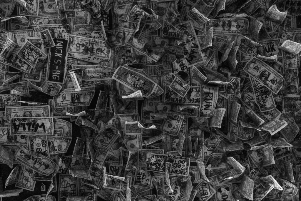 How do money launderers make money? grayscale photo of a bunch of metal tools